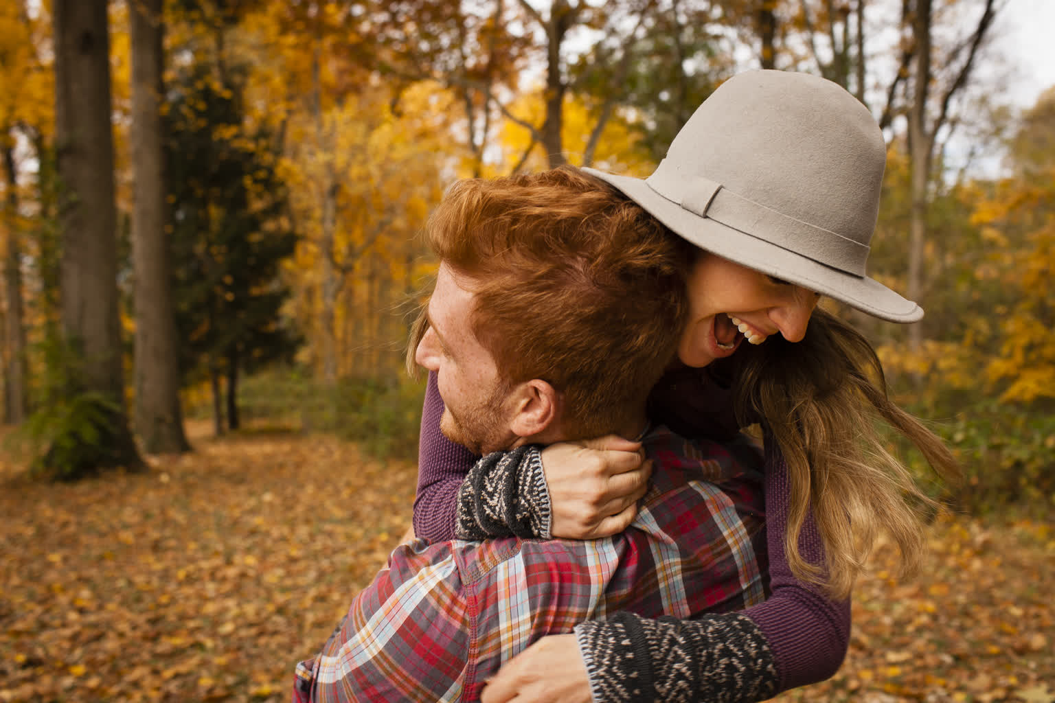 young-couple-hugging-in-autumn-forest-2022-03-07-23-55-13-utc.jpg