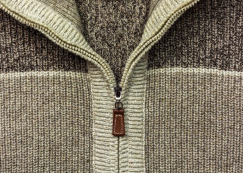Background, texture, structure, zipper sewn into woolen fabric Svetlyak shades