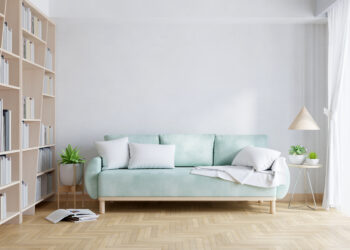 Green sofa in white living room with copy space for mock up, 3D rendering